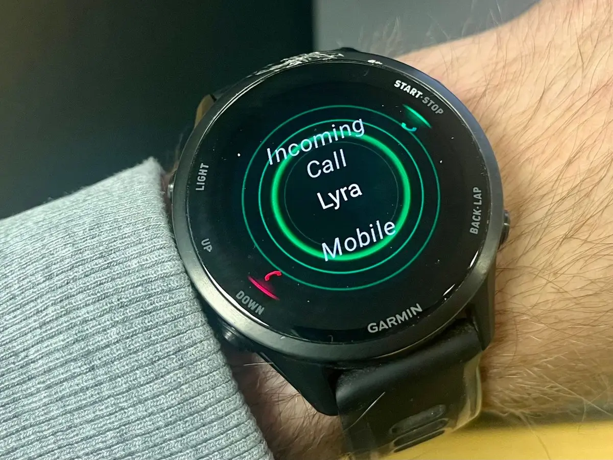 A Garmin watch showing an incoming call from Lyra, the Keryx voice assistant