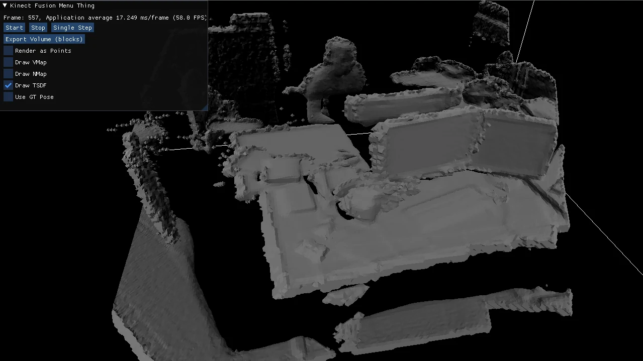 The reconstruction app showing a gray 3D surface model of a desk scene